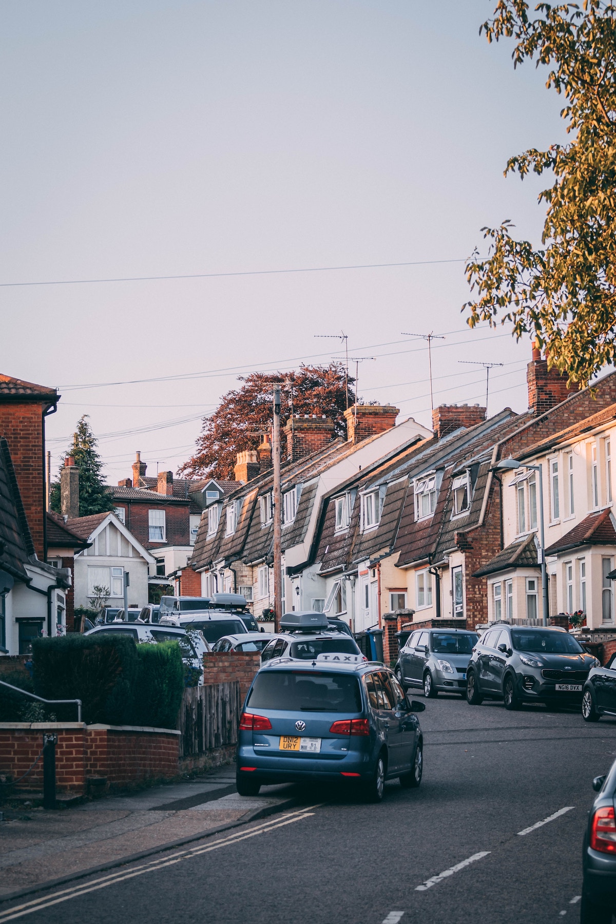 View of suburban, red brick house from the back garden, in the United Kingdom